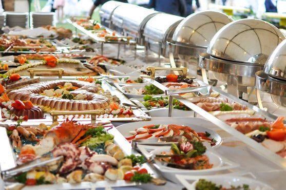 table catering services, including tomatoes, celery, chicken tenders, sauces, salami and pepperoni slices, appetizers.